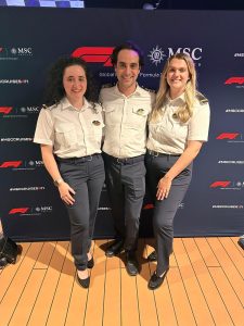 Three people stood together who work for MSC Cruises including Chiltern Maritime deck cadet Samantha Kaszuba.